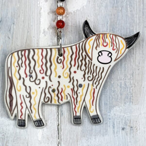 Multi-colour Highland Cow decoration. Handmade in the UK